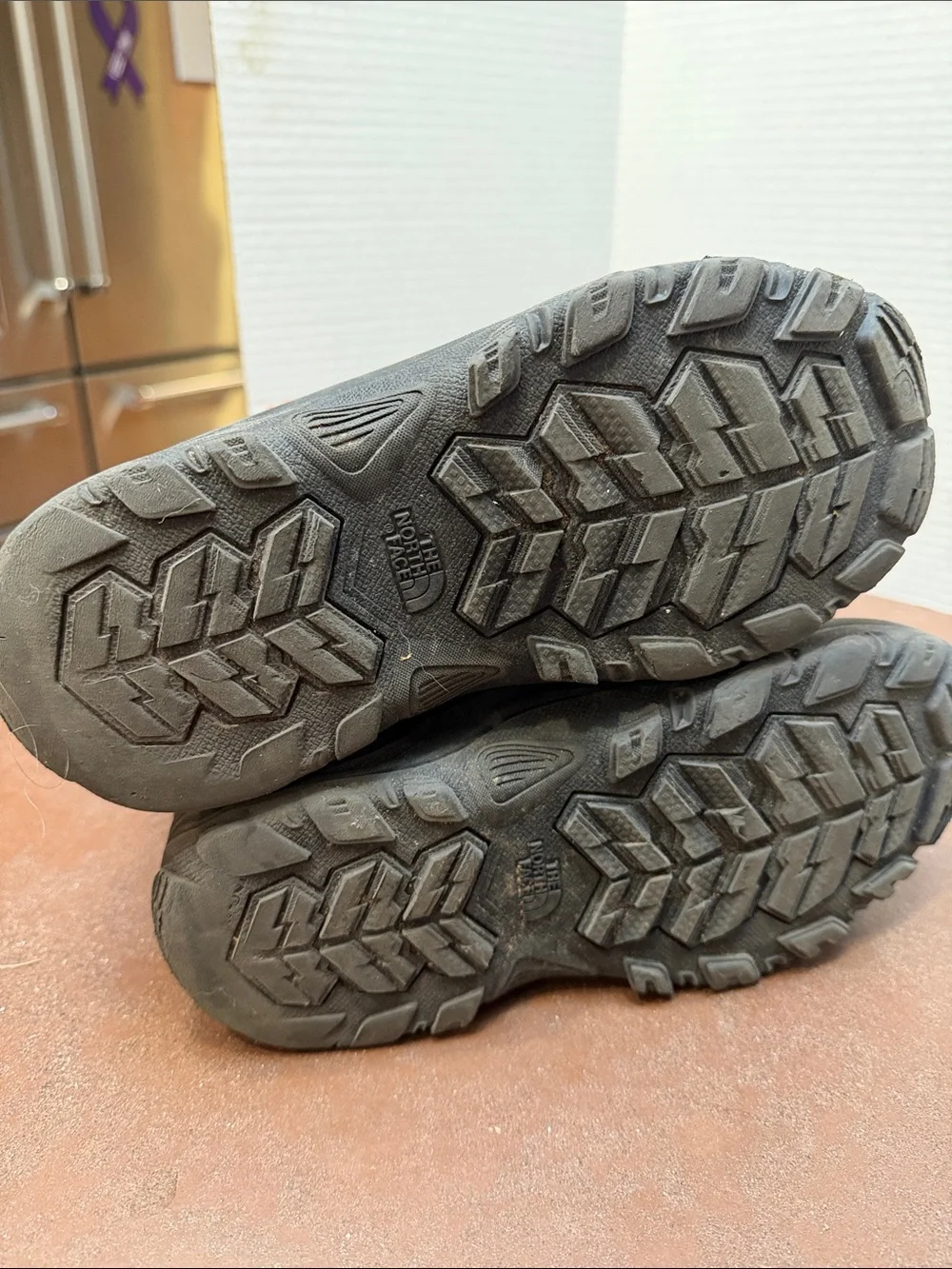 The North Face Kids Brown and Black Winter Boots with Orange Laces